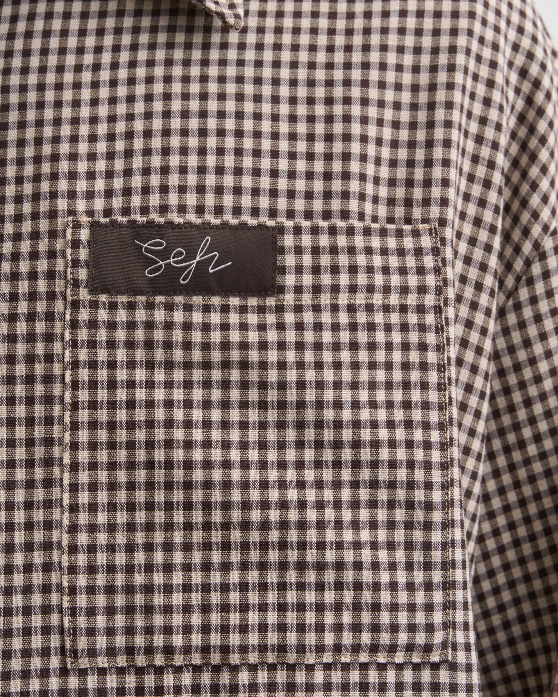 1714_b0aa76d324-sefr_fw26_button-up-shirt-whitedark-brown-check_8845-large