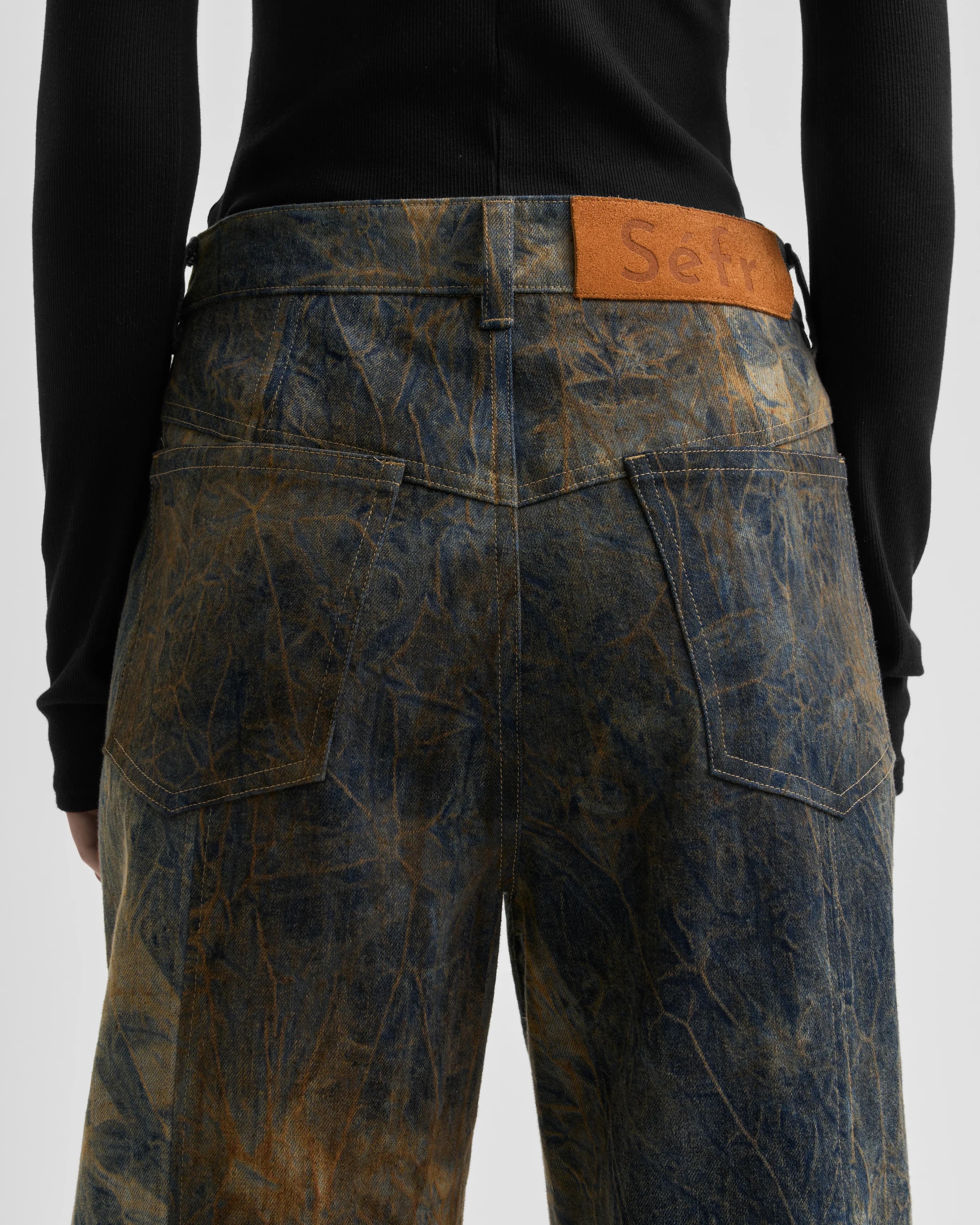 1779_b26a8bbf5f-sefr_fw26_over-dyed-back-slit-jeans-muted-neuterals_-8982-large